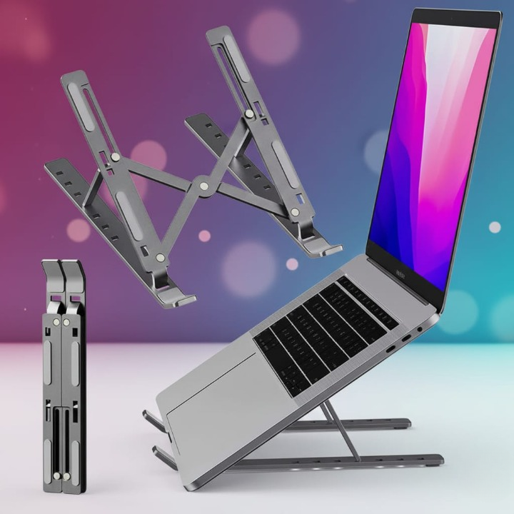 Foldable Aluminum Adjustable Laptop Stand in silver color with laptop on it - 6 height levels